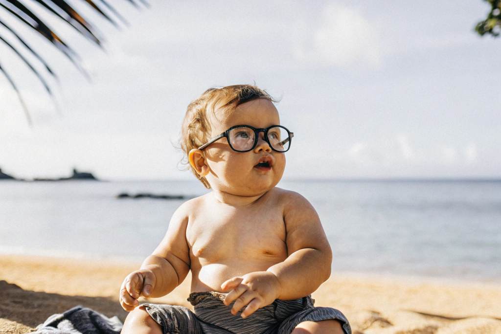 a-baby-with-glasses-on-the-beach.png a-baby-with-glasses-on-the-beach.png